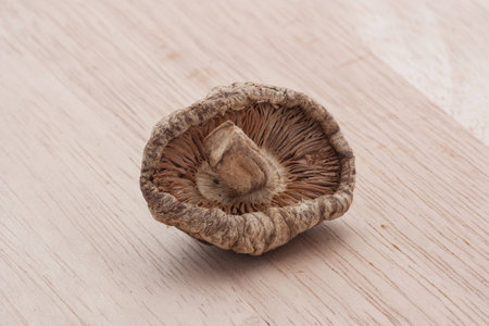 dried shiitake mushrooms on wooden tableの写真素材