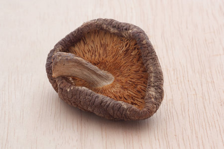 dried shiitake mushrooms on wooden tableの写真素材