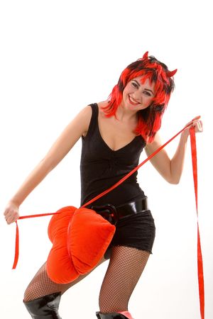 sexy devil woman and red heart isolated on the white backgroundの写真素材