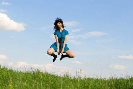 happy young woman is jumping