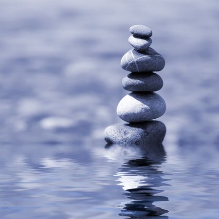 balanced stones on the waterの写真素材
