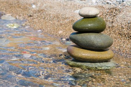 balanced stones on the water