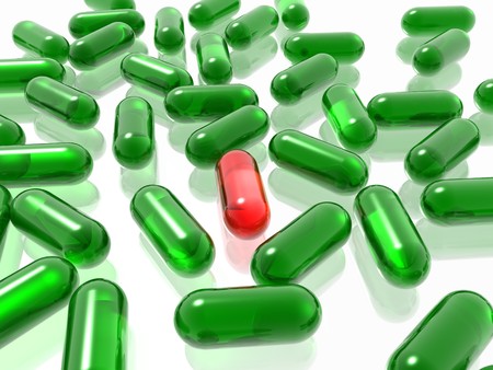 red and green pills on white backgroundの写真素材