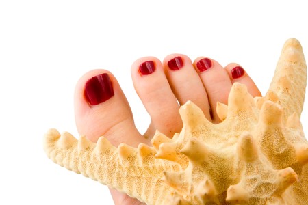 Woman feet isolated in white background