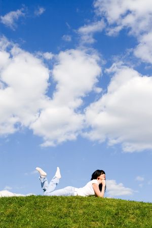 pretty woman rest on the green grassの写真素材