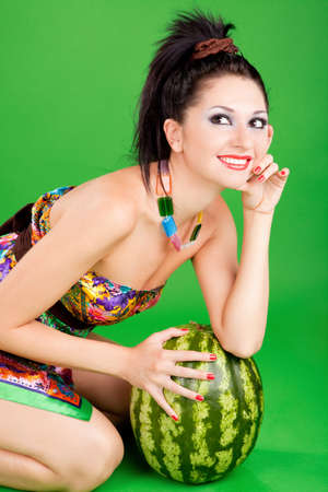 fashion woman with watermelon on the green backgroundの写真素材