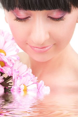 lovely brunette with pink flowers の写真素材