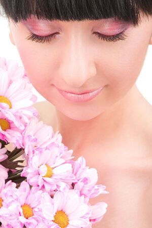 lovely brunette with pink flowers の写真素材