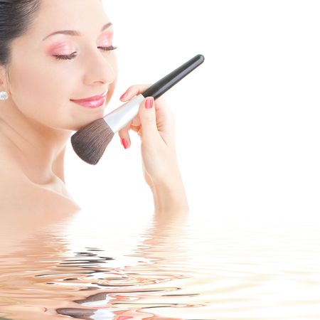 Young woman with brush for makeupの写真素材
