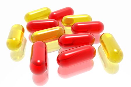 red and yellow pills on white backgroundの写真素材