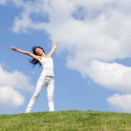 happy young woman dreams to fly on winds 
の写真素材