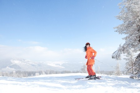 Happy girl with ski in the winter landscape の写真素材