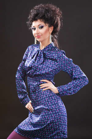 Young fashion woman on black background の写真素材