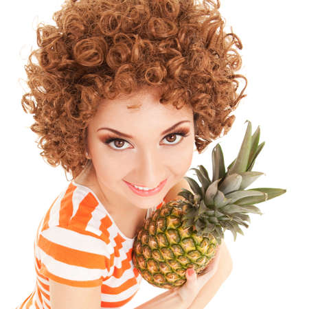 fun woman with pineapple on the white backgroundの写真素材
