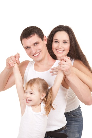 Happy mother, father and daughter playing on the white backgroundの写真素材