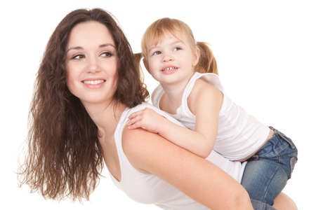 Happy mother and daughter playing on the white backgroundの写真素材