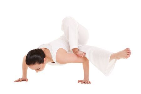 Young woman doing yoga exercise