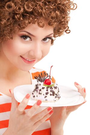 fun woman eating the cake on the white backgroundの写真素材