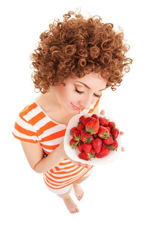 Fun woman with strawberry on the white backgroundの写真素材