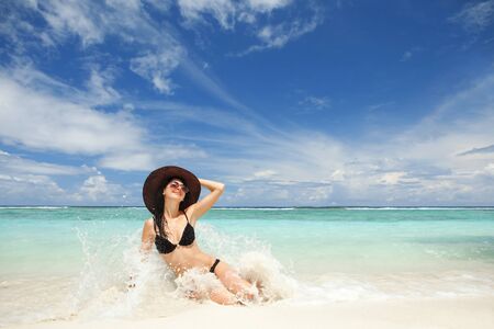Happy fashion woman on the beachの写真素材