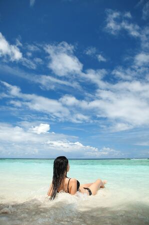 Cute woman relax on the summer beachの写真素材