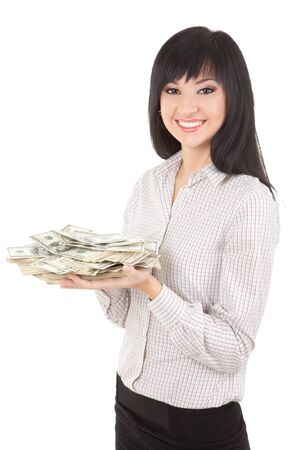 Young business woman with pile of moneyの写真素材