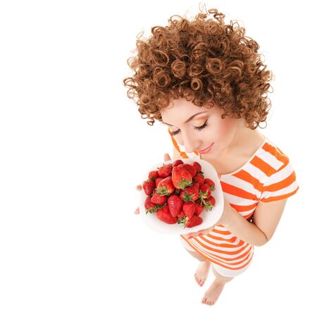Fun woman with strawberry on the white backgroundの写真素材
