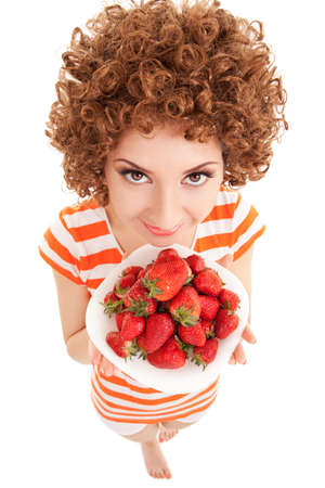Fun woman with strawberry on the white backgroundの写真素材