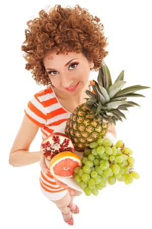 Fun woman with juicy fruits on the white backgroundの写真素材