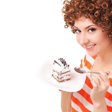 fun woman eating the cake on the white backgroundの写真素材