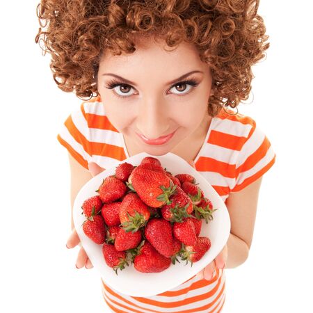 Fun woman with strawberry on the white backgroundの写真素材