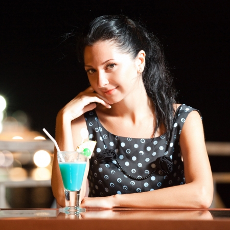 Fashion woman drinking cocktailの写真素材