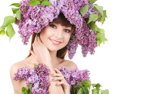 Young woman with lilac flowersの写真素材