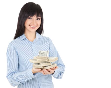Young business woman with pile of moneyの写真素材