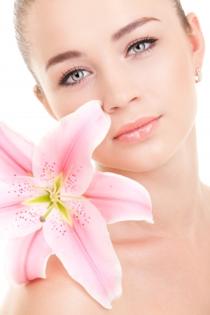 Portrait of a young beautiful woman with flowerの写真素材