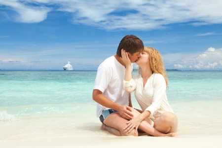 Young couple on the beach of seaの写真素材