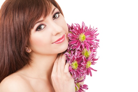 Portrait of a young beautiful woman with flowersの写真素材