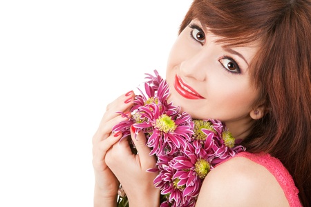 Portrait of a young beautiful woman with flowersの写真素材