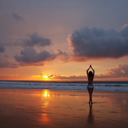 silhouette of woman on the sunsetの写真素材