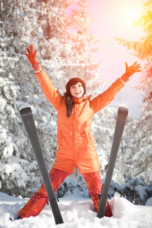Happy girl with ski in the winter landscapeの写真素材