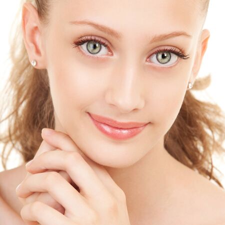 Portrait of young beautiful woman on white backgroundの写真素材