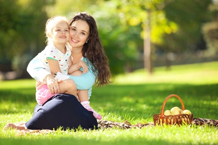 Mother with daughter in the parkの写真素材