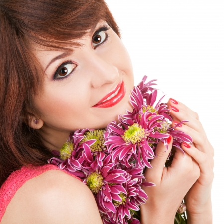 Portrait of a young beautiful woman with flowersの写真素材