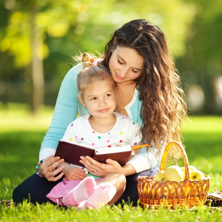 Mother with daughter in the parkの写真素材