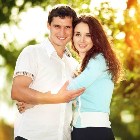 Young happy couple in the parkの写真素材