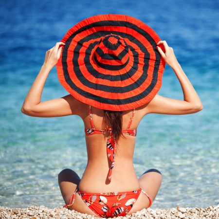 Young fashion woman rest on the beachの写真素材