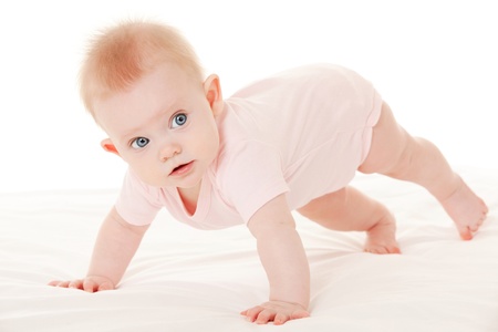 Baby on the white bed