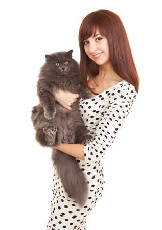 Pretty woman with funny kitten isolated on white background. Portrait of young woman holding big grey cat.の写真素材