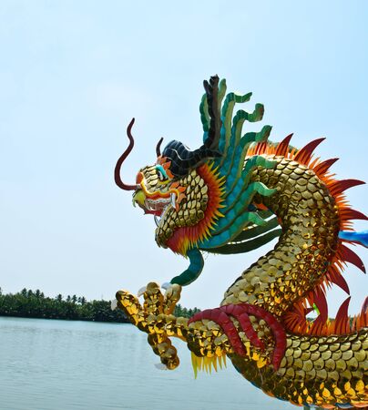 Dragon in temple near river with blue skyの写真素材