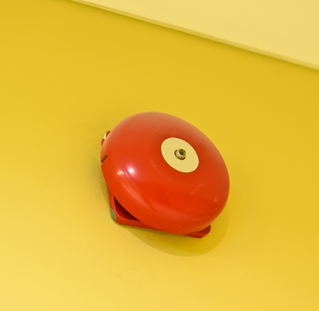 Red wall mounted Fire Alarm Bellの写真素材